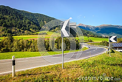 Roadsigns at a bridge in Val MÃ¼stair Engadin, GraubÃ¼nden, Switzerland Stock Photo