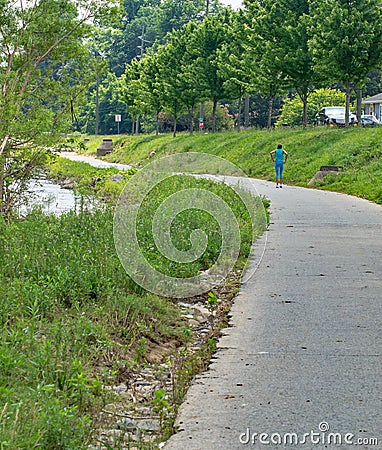 Early Morning Walker on the Roanoke River Greenway Editorial Stock Photo