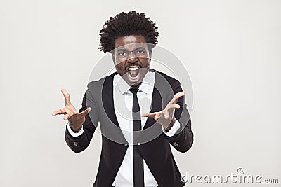 Roar! Angry man shouting at camera. Wild and crazy Stock Photo