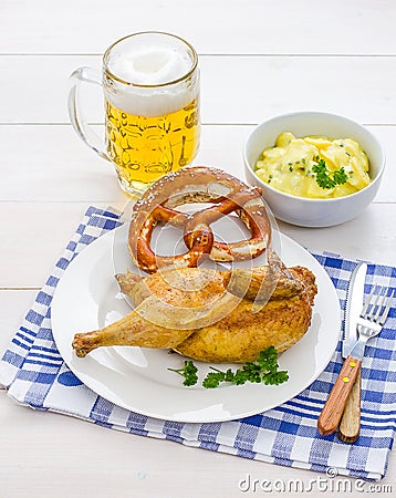 Roast chicken, beer, pretzel and potato salad Stock Photo