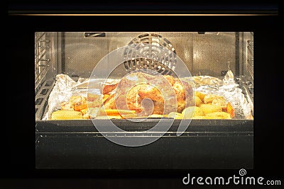 Roast chicken in the oven Stock Photo