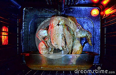 Roast chicken in the oven Stock Photo