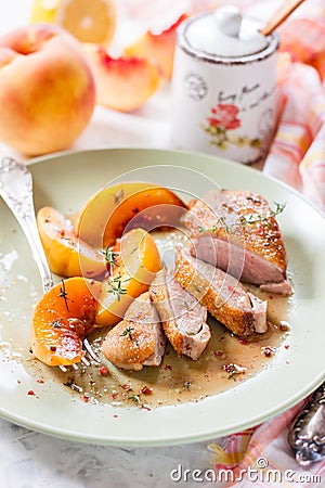 Roast duck breast with peaches Stock Photo