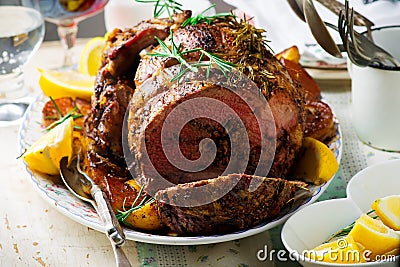 Roast lamb leg with Vegetables.style rustic. Stock Photo