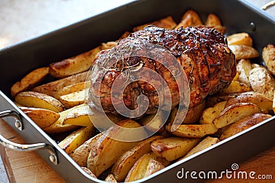 Roast of lamb with potatoes Stock Photo