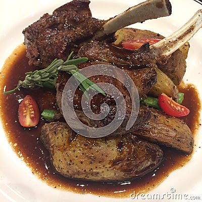 Roast leg-lamb black pepper sauce top with rosemary for celebrating your special occasion Xmas, New year, Valentine, Ester, Thanks Stock Photo