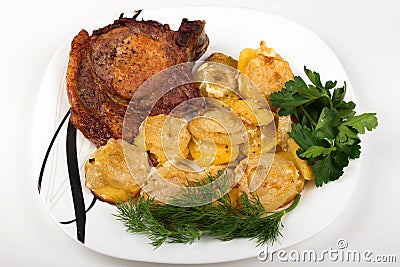 roast meat with potatoes and onions on a plate on a white background Stock Photo