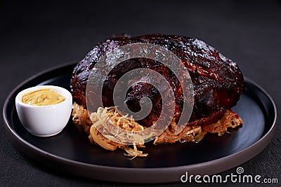 Roast pork knuckle with stewed cabbage and mustard Stock Photo