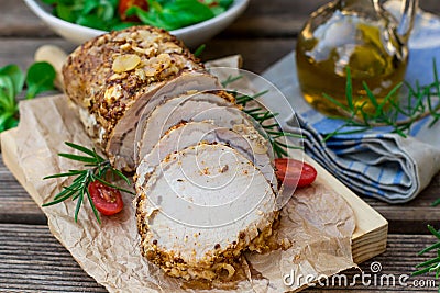 Roast pork loin in mustard marinade with rosemary Stock Photo