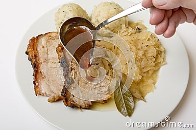 Roast port with pickled cabbage and dumpling Stock Photo