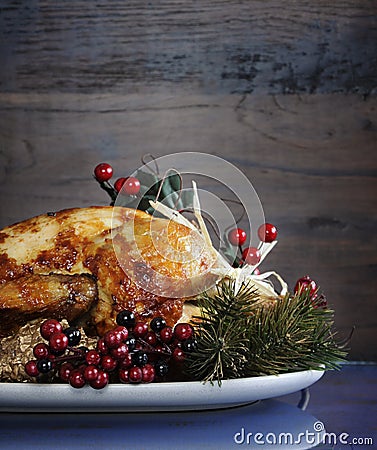 Roast turkey against dark rustic wood background. Vertical with copyspace Stock Photo