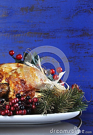 Roast Turkey on dark blue rustic wood background - vertical with copyspace. Stock Photo