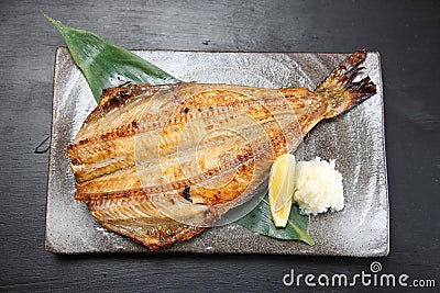 Roasted atka mackerel with lemon Stock Photo