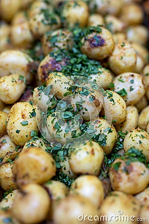 Roasted baby potato with vegetables and parsley Stock Photo