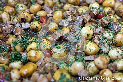 Roasted baby potato with vegetables and parsley Stock Photo