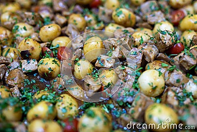 Roasted baby potato with vegetables and parsley Stock Photo