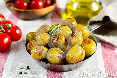 Roasted baby potatoes with rosemary Stock Photo