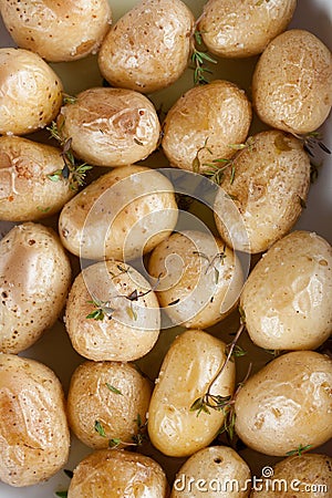 Roasted baby potatoes with thyme Stock Photo