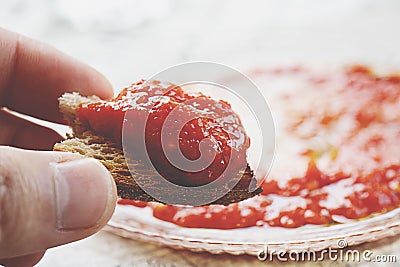 Roasted Bread, Tomato Sauce Close Up on a Kitchen Table Stock Photo