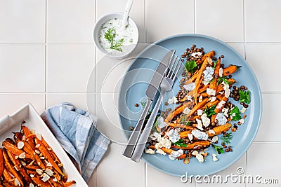 Roasted Carrot Lentil Salad with Feta, Yogurt and Dill. Stock Photo