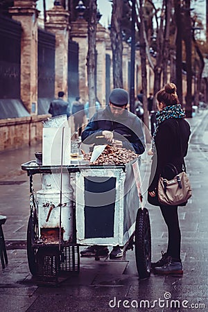 Roasted chestnuts street seller in the city of Seville, Spain Editorial Stock Photo