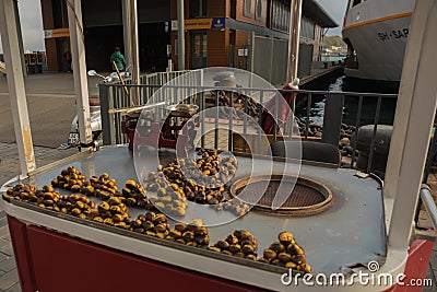 Roasted chestnuts in street vendors. Popular food among tourists and Turks. Istanbul, Turkey Editorial Stock Photo