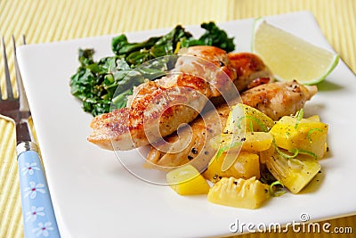 Roasted chicken breast with saute kale and squash vegetables Stock Photo