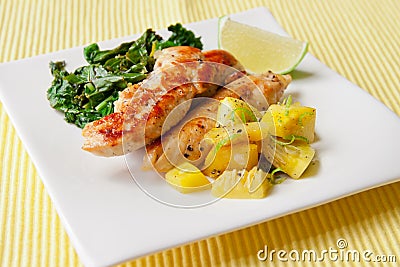 Roasted chicken breast with saute kale and squash vegetables Stock Photo