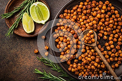 roasted chickpeas with smoked paprika served with lime and rosemary. Stock Photo