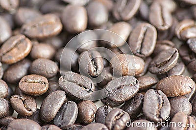 Roasted coffee beans background, coffee seeds, berries from the coffea plant Stock Photo