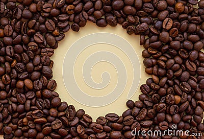 Roasted coffee beans with circle copy space in the middle. Aroma drink concept. Stock Photo