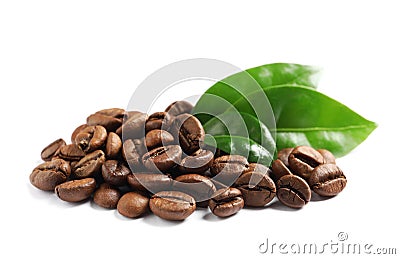 Roasted coffee beans and fresh green leaves on white Stock Photo