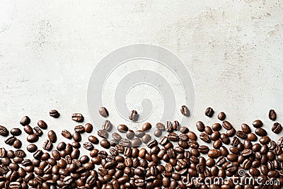 Roasted coffee beans on grey background with space Stock Photo