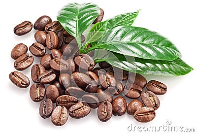 Roasted coffee beans and leaves. Stock Photo