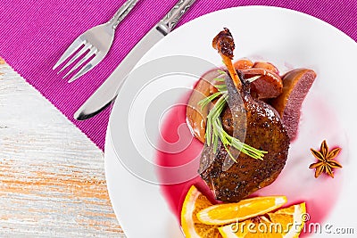 Roasted duck legs baked in oven in mulled wine Stock Photo