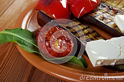 Roasted eggplants with tomato and bell peppers Stock Photo