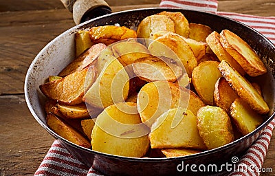 Roasted golden crispy potato slices Stock Photo