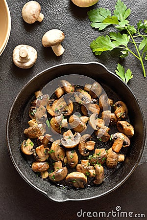 Roasted mushroom in cast iron pan Stock Photo
