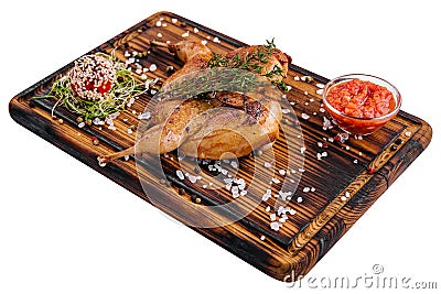 Roasted partridge with sauce tomato on wood board Stock Photo
