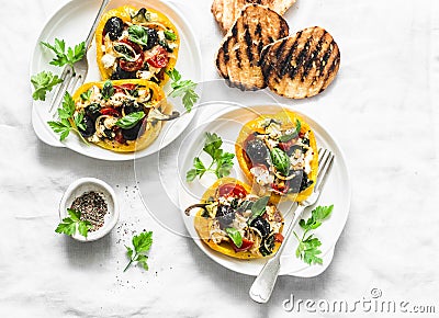 Roasted peppers stuffed greek saladbell - delicious appetizers, snacks on a light background, top view. Mediterranean style Stock Photo
