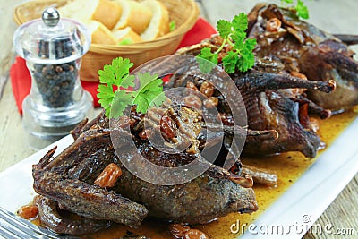 Roasted pigeon with currants Stock Photo