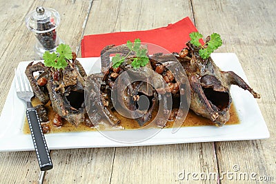 Roasted pigeon with currants Stock Photo