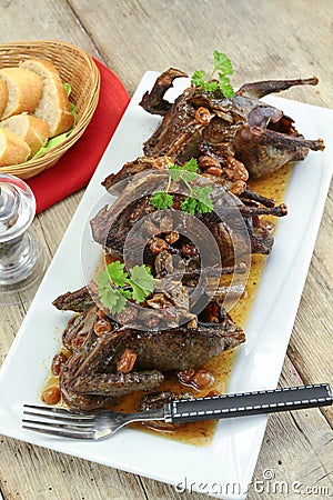 Roasted pigeon with currants Stock Photo