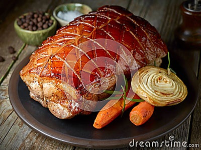 Roasted pork on dark plate Stock Photo