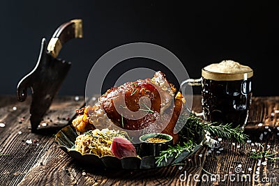 Roasted Pork knuckle with beer and sauerkraut. Oktoberfest menu Stock Photo