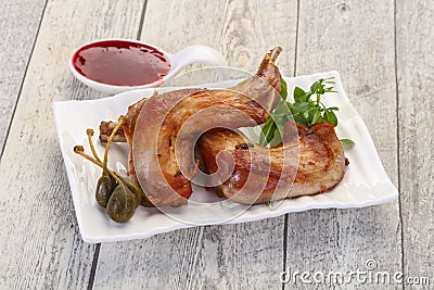 Roasted rabbit legs Stock Photo