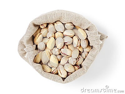 Roasted salty pistachios nuts in sack bag from above Stock Photo