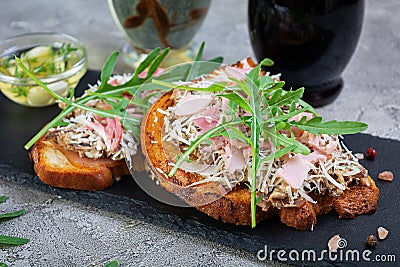 Roasted sandwiches with caramelized onion mixed with cream cheese and herbs. Grilled sandwich Stock Photo