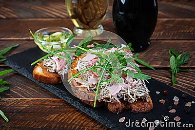 Roasted sandwiches with caramelized onion mixed with cream cheese and herbs. Grilled sandwich Stock Photo