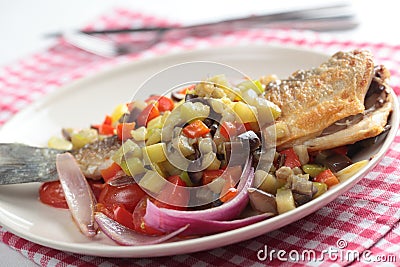 Roasted sea bass with vegetables Stock Photo